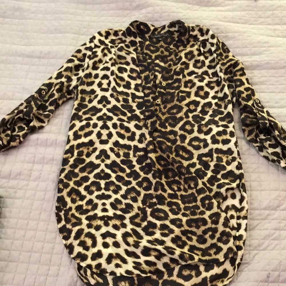 Leopard blouse with gold button detail. 3/4 sleeve